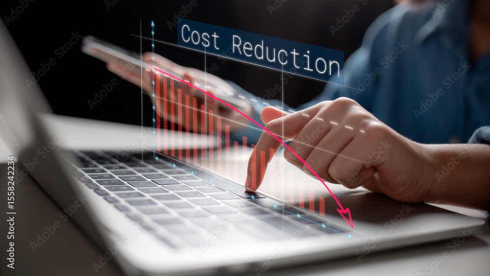 Aufkleber close-up of a hand using a laptop with a downward cost reduction graph overlay. concept of expense c