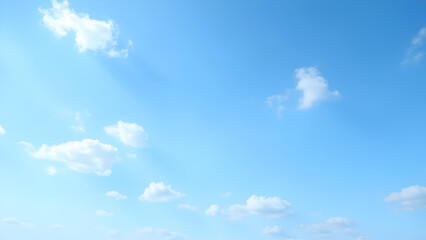 Serene blue sky with fluffy white clouds creating a peaceful and airy atmosphere