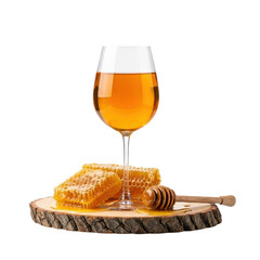 A glass filled with a golden honey based drink or mead, accompanied by natural honeycomb pieces and a wooden honey dipper, all resting on a rustic wood slice.