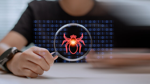 Hand holding magnifying glass detecting malware bug in binary code. Cybersecurity concept with digital virus scanning, software debugging, and data protection from cyber threats.