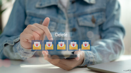 Close-up of a person tapping delete on smartphone to remove virus-infected emails, illustrating email malware detection, cyber threat prevention, phishing scam protection, and digital safety.