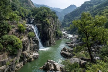 Serene Waterfall Cascading into a Green River Surrounded by Lush Mountains and Rocky Terrain in a Tranquil Natural Landscape