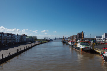 View of the Neuer Hafen (New Harbor) in the Havenwelten district of Bremerhaven, Germany, looking towards the Weser estuary.