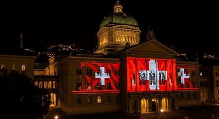 Swiss Parliament Building Illuminated with National Flag Projection at Night