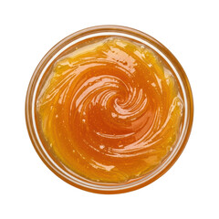 A top down view of a golden, viscous substance, possibly honey, caramel, or fruit preserve, swirled in a clear glass bowl, showcasing its rich texture and color.
