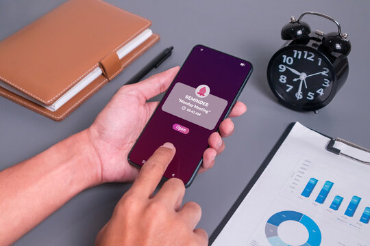 Monday Meeting reminder notification on mobile phone screen. New event notice message on mobile phone.