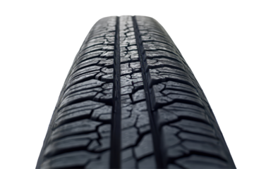 Black tire track outlines a clear wheel trace on a deserted road suggesting recent movement and travel activity