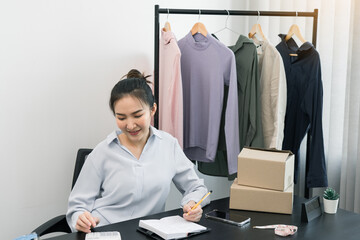 Young asian entrepreneurs are working and smiling.