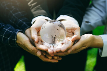 People holding earth environmentally together sustainable Save Earth. the Environment World Earth Day concept.