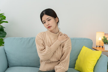 woman holding on shoulder and while and suffer from unbearable pain health and problems, chronic...
