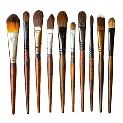 Fototapeta premium A collection of well-used paint brushes arranged in a row on a black background