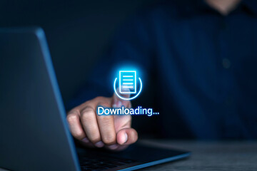 Person s finger touching downloading icon on a laptop screen