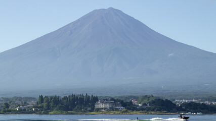 Mount fuji san at Lake kawaguchiko in japan on Day.Fisherman with beautiful sunrise mood of Fuji Mountain at Yamanaka lake.