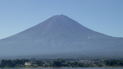 Naklejka premium Mount fuji san at Lake kawaguchiko in japan on Day.Fisherman with beautiful sunrise mood of Fuji Mountain at Yamanaka lake.