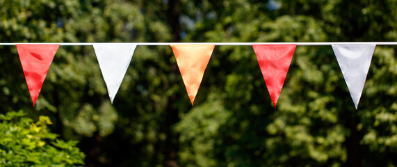 A row of flags with red and white stripes