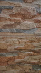 the background of the house wall uses natural stone