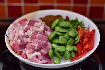 Spicy stir fried pork with Cluster Bean (Bitter Bean or stink beans) popular southern Thai food, Spicy stir fried chicken with Cluster Bean (Bitter Bean or stink beans).Thai southern food