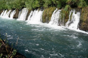 Obraz premium Cascading waterfalls in Bunski Kanal near Blagaj, Bosnia and Herzegowina