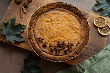 Pumpkin pie garnished with anise. Homemade traditional American thanksgiving pie, top view
