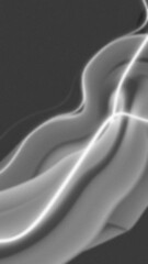 Abstract monochrome image showing wavy shapes highlighted with light against a dark background with a blurred effect