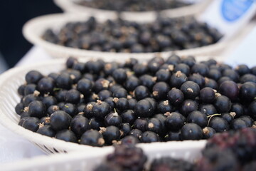 Berries on a large plate on the table. Summer harvest.