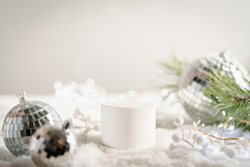 Winter Christmas composition with geometric shapes podiums and christmas decorations in snow. Empty pedestal for product presentation and for advertising display