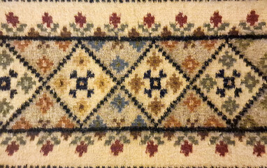 An old rug with traditional Romanian motifs
