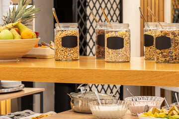Hotel Buffet Breakfast with Cereal Options jars on the table