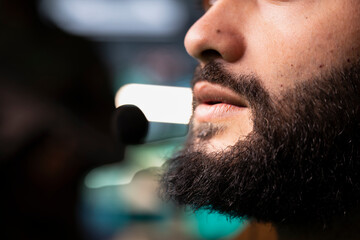 Intelligence agency expert using headset mic to call in air strikes on enemy troops. Close up of...