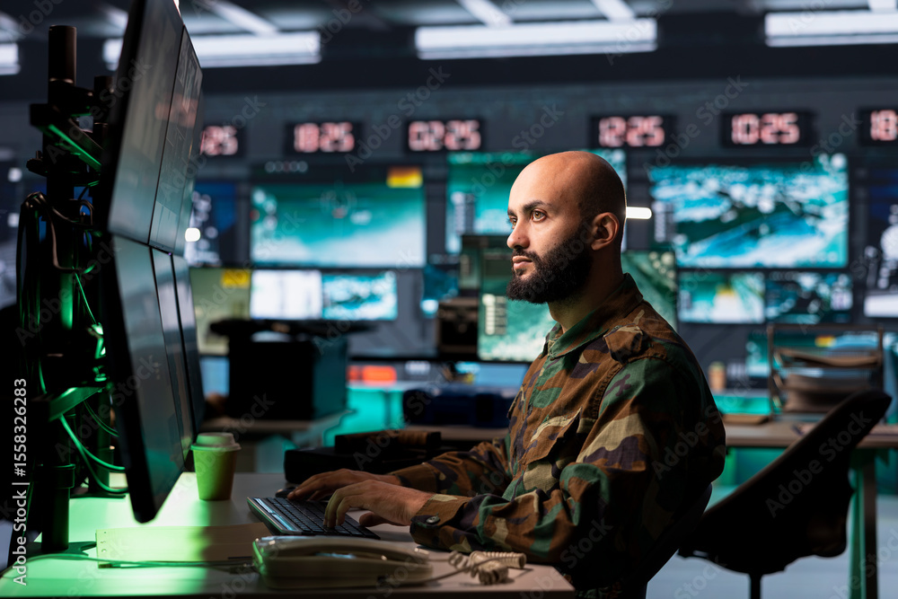 Poster counterterrorism division officer in command center using target acquisition tech to detect enemy lo