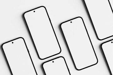 Five Smartphones with Blank Screen Lying on White Table
