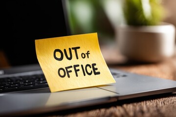 Out of office notice displayed on a laptop during vacation time, indicating absence from work for leisure and relaxation