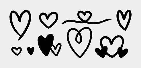 A set of cute ink hearts isolated on a gray background. Vector hand-drawn illustration in doodle style. Perfect for cards, decorations, various designs.