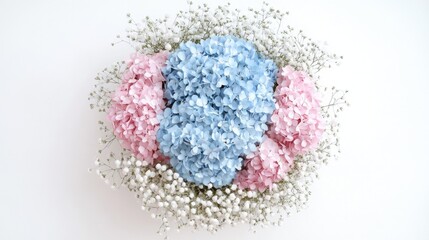 Beautiful round bouquet of light blue and pink hydrangeas with gypsophila in a milk carton on white background