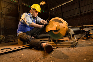 Cutting of a steel with splashes of sparks in the industrial shop