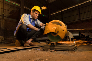 Cutting of a steel with splashes of sparks in the industrial shop