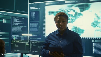 Governmental agency cyber defense team analyzing cyber attacks. IT security professionals working...