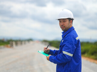 Constructor Engineer Man Using tablet Construction Site
