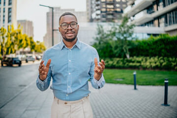 Businessman engaging with city surroundings while showcasing professional attire in urban setting