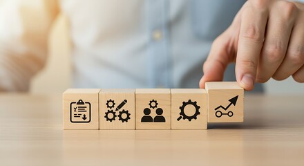 Design Thinking Process Stages Concept – Wooden Blocks with Icons Representing Innovation Workflow.