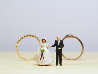 Mini toy of action figure at table with blurred background. Art photography concept design....