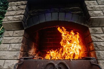 Close-up of a bright fire in a barbecue.