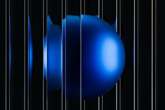 Abstract 3D design featuring a blue fluted glass sphere with reflections