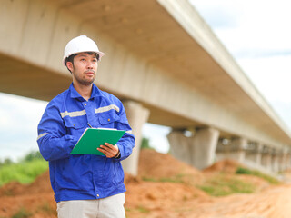 Inspector or engineer is inspecting construction and quality assurance new house using a blue...