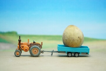 Mini toy of action figure and car at table with blurred background. Towing car concept design....