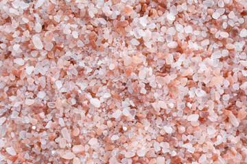 Himalayan pink salt background, top view. Organic seasoning and culinary ingredient concept