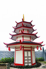 A Captivating View of a Traditional Japanese Pagoda with Red and White Details Against Clear Sky