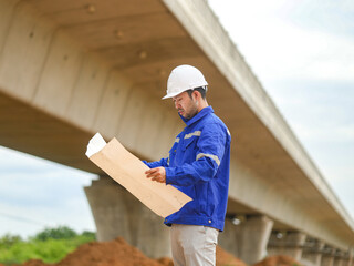 Back one architect standing outdoor at home building construction site