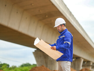 Back one architect standing outdoor at home building construction site