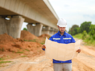 Back one architect standing outdoor at home building construction site